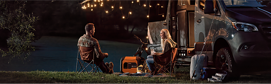 Camping at night under lights powered by a portable power station
