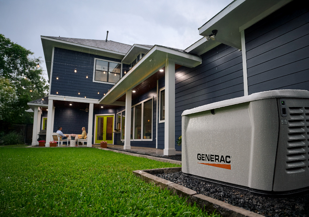 Generac home standby generator powering a home in the rain