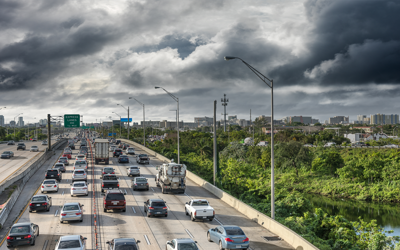 cars headed out of a city during a storm