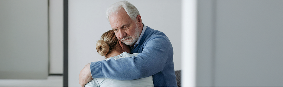 Man hugging woman
